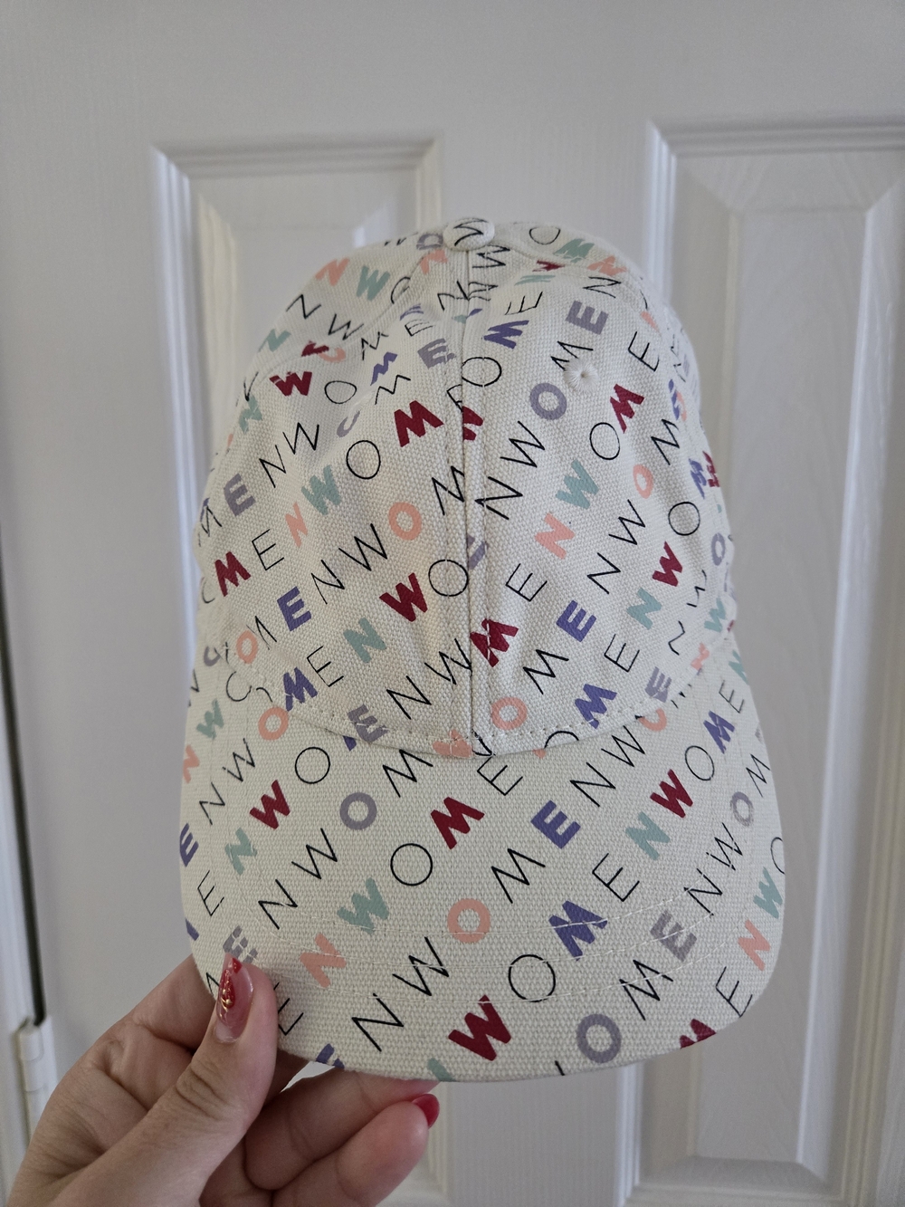 Madewell Cream Canvas Hat That Says "Women" On It